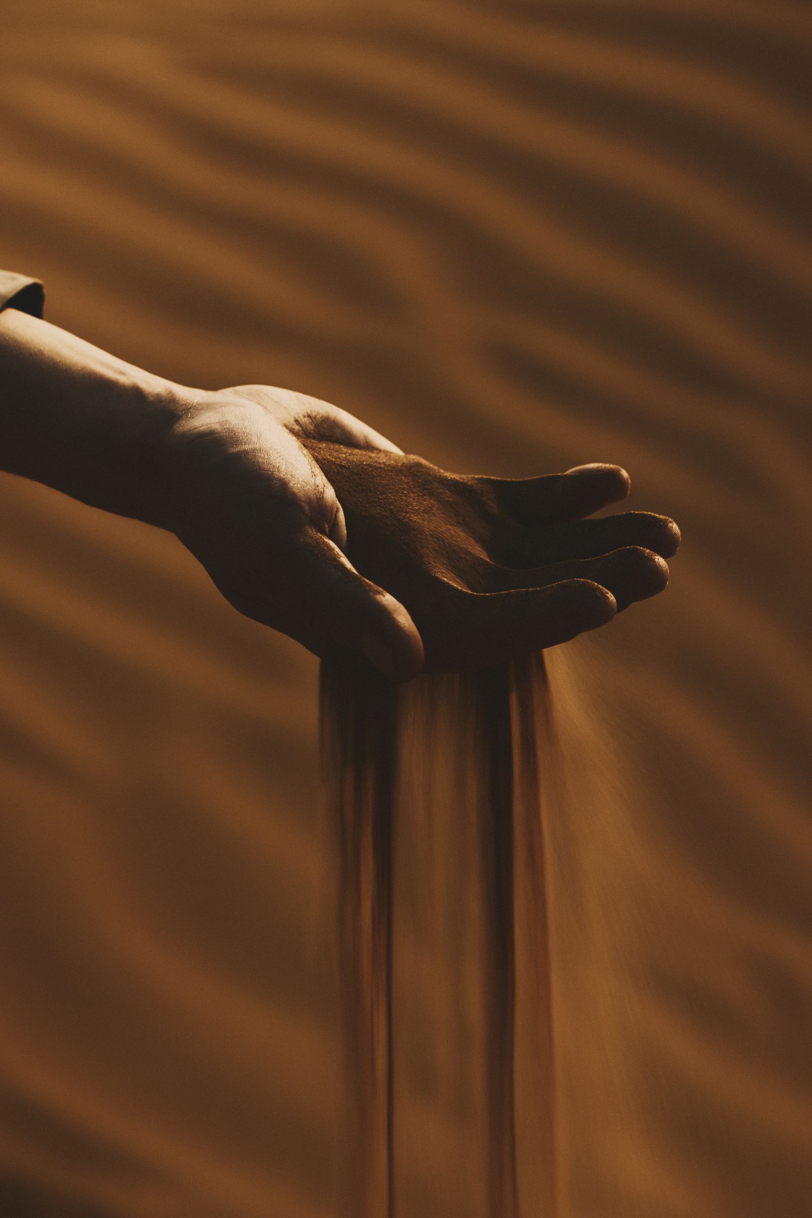 Sand through an open hand